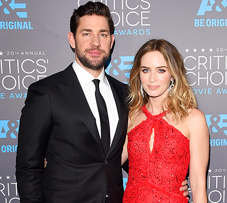John Krasinski taking a picture with his wife Emily Blunt.